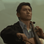Departures movie - still image: cellist
