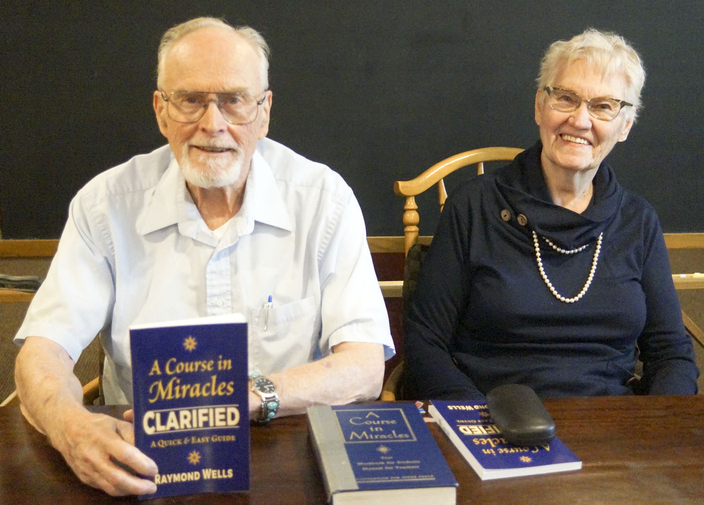 RMMC talk attendees (Ray Wells and Marjie Wells with Ray's book: A Course In Miracles Clarified
